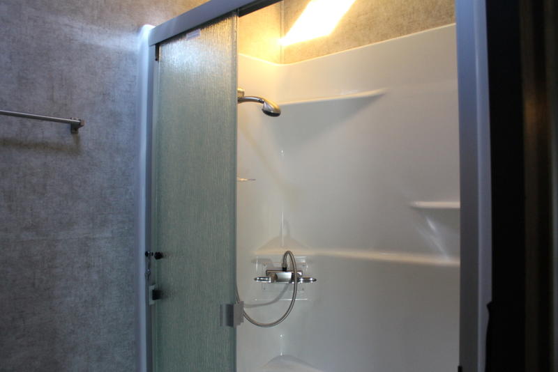 A brand new rv shower with new paneling walls