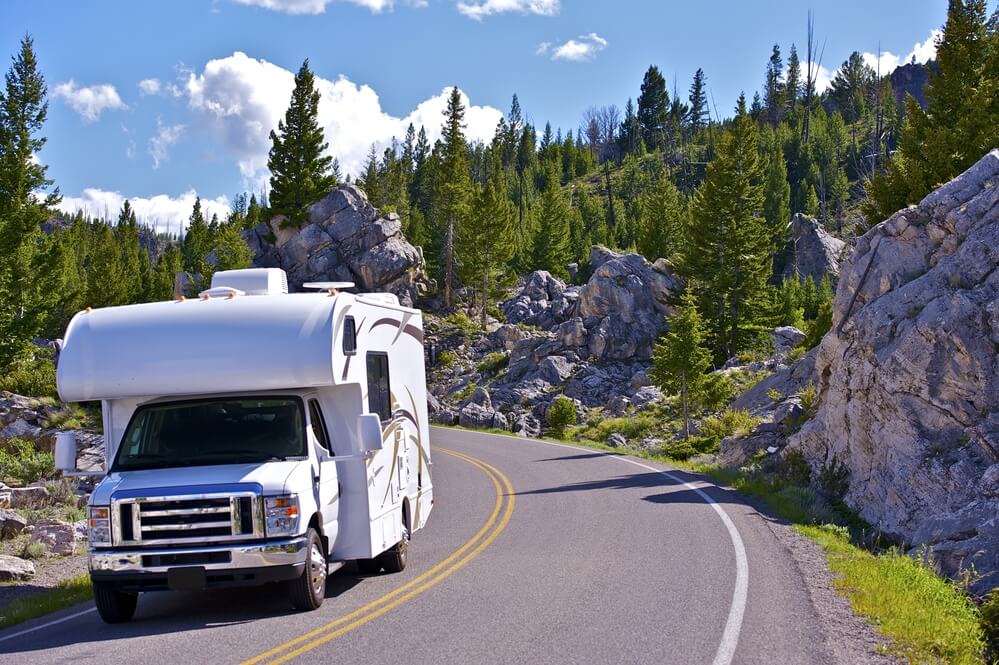 A travelling RV motorhome on the road in Yellowstone Park