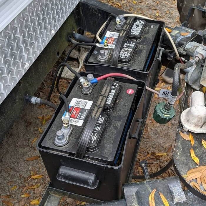 Batteries attached to a camper trailer